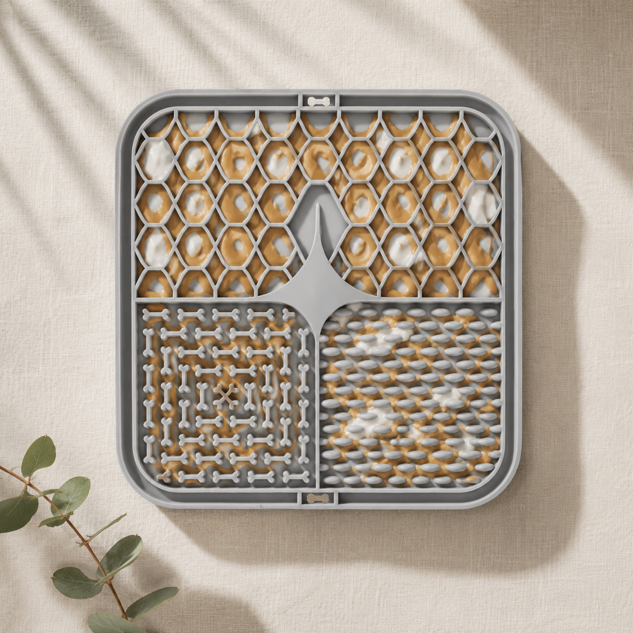 Calm Lick Mat loaded with peanut butter and yogurt in its three textured zones